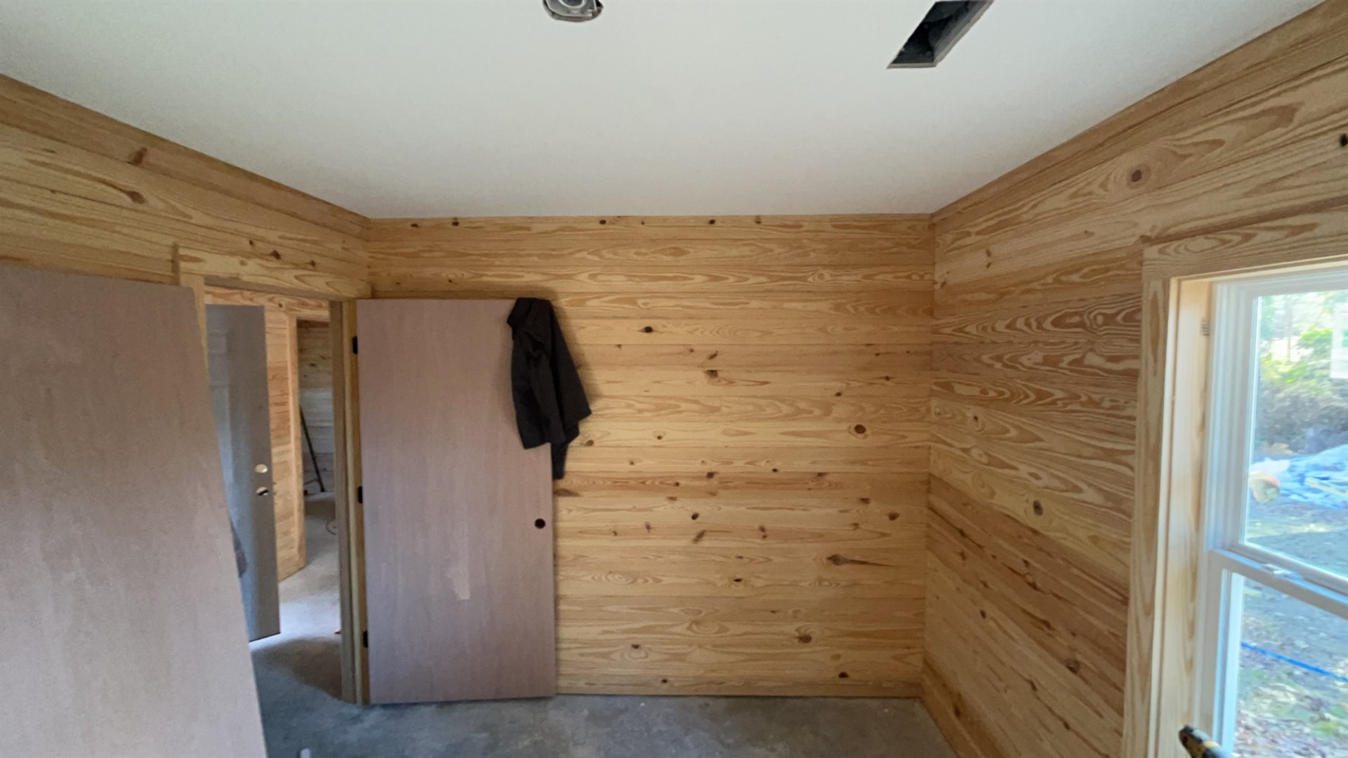 Pine wall boards installed in a bright interior
